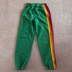 Aviator Nation size 10 green sweatpants with the stripes on the side.